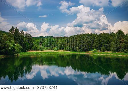 Panoramic View On Mountain Lake And Forest