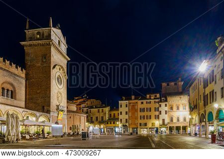 Mantua, Italy - February 26, 2023: Evening View Of The Piazza Delle Erbe, With Local Monuments And B