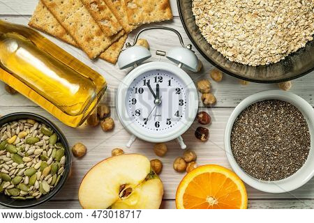 Diet Time. Food Clock. Healthy Eating With Oat Flakes, Hazelnuts, Chia Seeds, Pumpkin Seeds, Sunflow