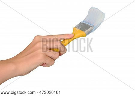 A Woman's Hand Paints The Wall With A Brush In White, Isolated On A White Background. Lifestyle Repa