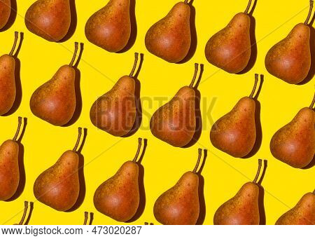 Colorful Pear Pattern. Orange Bera Pears On A Yellow Background. Ripe Juicy Fruits With Shadow Top V