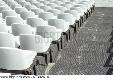 Seats Of Tribune On Sport Stadium. Concept Of Fans, Chairs For Audience, Cultural Environment Concep