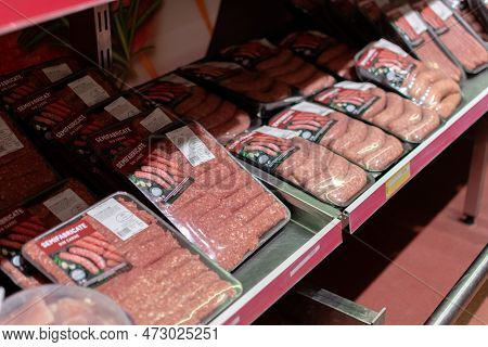 Chisinau, Moldova - October 6, 2022: Uncooked Fresh Meat Sausages And Moldovan Cutlets (mititei) Fro