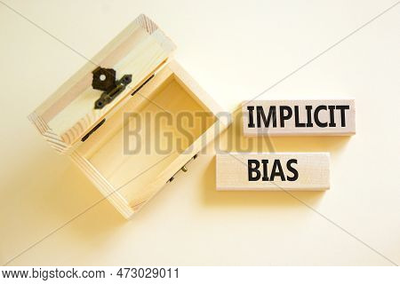 Implicit Bias Symbol. Concept Words Implicit Bias On Wooden Block. Beautiful White Table White Backg