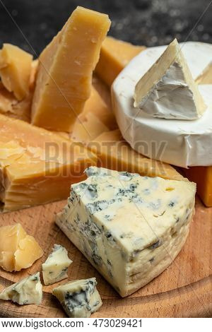 Parmesan. Cheeses Mix Set Dor Blu Chedar Camamber Brie. Different Types Of Cheese With Knife On A Li
