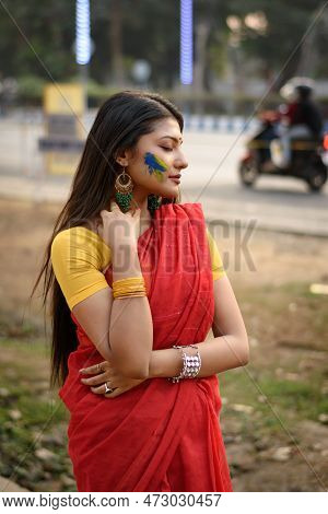 Portrait Of A Pretty Young Indian Woman Wearing Traditional Saree And Jewellery With Spring Festive 