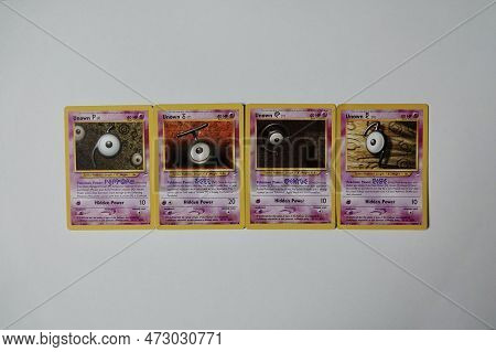 Prague, Czech Republic - April 3 2022: Abbreviation Ptcg Composed Of Unown Pokemon Cards. The Pokemo