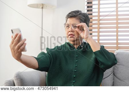 Presbyopia, Hyperopia Mature Asian Woman Holding Eyeglasses Having Problem With Vision Problem Tryin