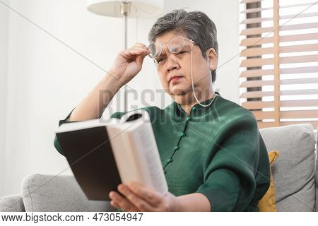 Presbyopia, Hyperopia Mature Asian Woman Holding Eyeglasses Having Problem With Vision Problem Tryin