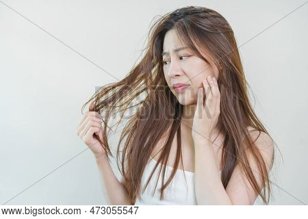 Damaged Hair, Frustrated Asian Young Woman, Girl Hand In Holding Splitting Ends, Messy Unbrushed Dry