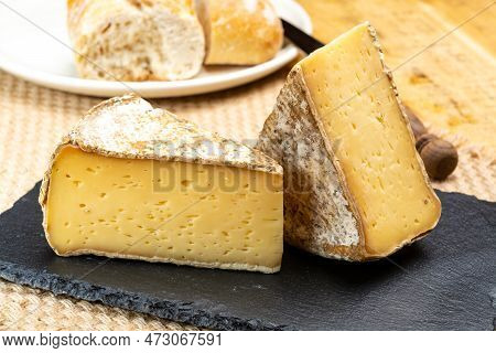 Pieces Of Cheese Tomme De Montagne Or Tomme De Savoie Made From Cow Milk In French Alps Close Up