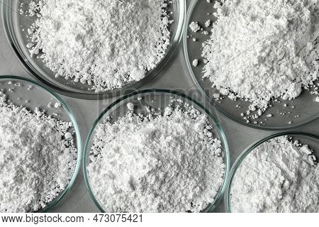 Petri Dishes With Calcium Carbonate Powder On Grey Table, Flat Lay