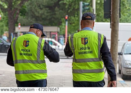 Tirana, Albania - April 25 2019: Two Municipal Policemen (policia Bashkiake) Patrolling The Streets.