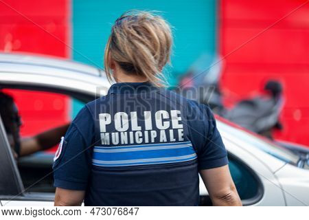 Saint-gilles Les Bains, La Réunion - June 25 2017: French Female Police Officer In Bulletproof Vest 