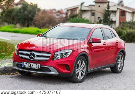 Side, Turkey - February 04 2023:         Red  Mercedes-benz Gla  Is Parked  On The Street On A Warm 