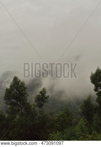 Rain Bearing Monsoon Clouds Over Western Ghats Mountains In South India, In Late Summer Season
