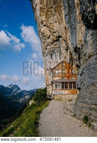 Swiss Alps And A Mountain Restaurant Under The Aescher Cliff Viewed From Mountain Ebenalp In The App