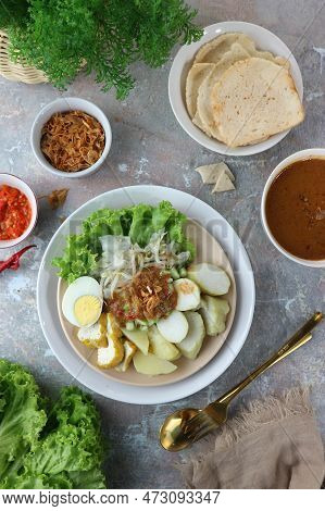 Mixed Vegetables With The Peanut Sauce On A Wooden Table
