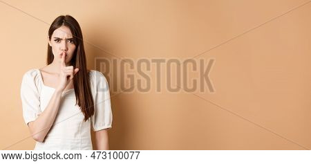 Angry Young Girl Scolding Bad Behavious, Shushing And Frowning Mad, Tell To Be Quiet, Looking Disple