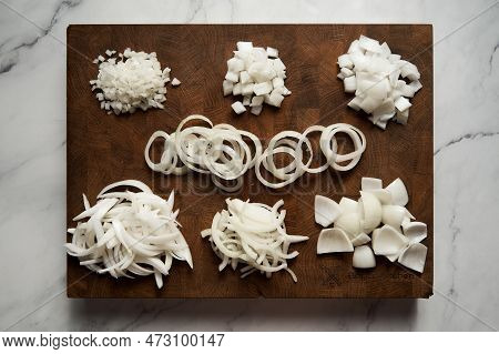 Different Cuts Of Onions On Wood Board. Photo Show Different Onion Cuts From Small To Large Dice, Ri