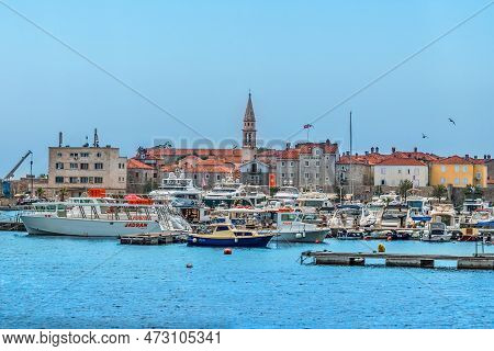Budva, Montenegro - June 17, 2021: View From The Slovenska Plaza Beach To The Dukley Marina And Old 