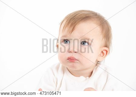 Stock Studio Photo With The White Background Of A Baby's Face