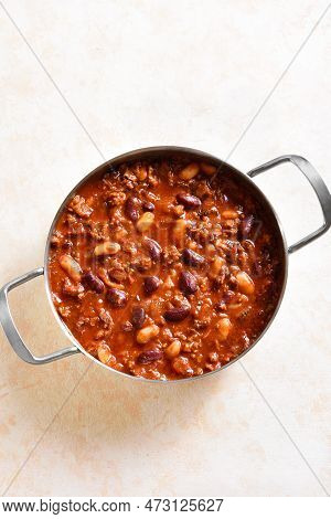 Cooked Red Beans With Ground Beef, Jalapeno Pepper And Bacon In Cooking Pan Over Light Stone Backgro