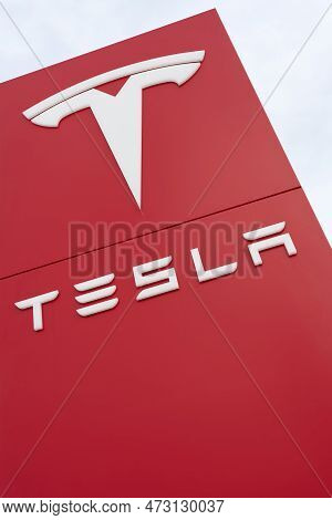 Magdeburg, Germany - March 19, 2023: Tesla Car Brand Advertising Sign In Front Of A Tesla Car Dealer
