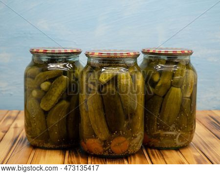 Preservations, Conservation. Salted, Pickled Cucumbers In A Jars On An Wooden Table. Pickling Cucumb
