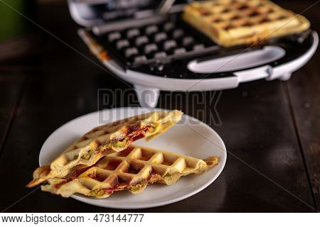 Pizza Waffles, Piffle. Waffles Stuffed With Sausage, Cheese, Tomatoes On A Plate.