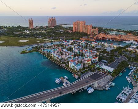Harborside Villas aerial view at sunset with Atlantis Hotel at the background at Nassau Harbour, from Paradise Island, Bahamas.