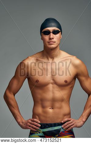 Portrait Of A Swimmer In A Cap And Mask, Half-length Portrait, Young Athlete Swimmer Wearing A Cap A