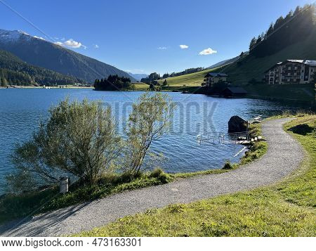Sports And Recreational Trail Along The Alpine Lake Davos Or Loop Around Mountain Lake Davosersee, D