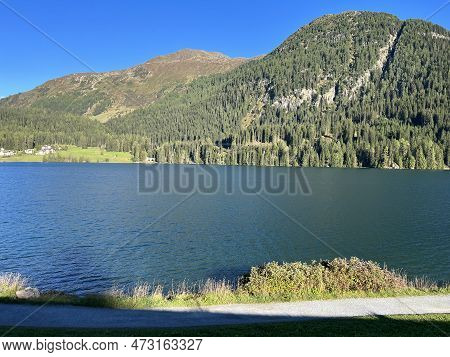 Sports And Recreational Trail Along The Alpine Lake Davos Or Loop Around Mountain Lake Davosersee, D
