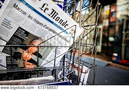 Paris, France - Mar 20, 2023: Seen Through The Steel Secured Bars Of A Press Kiosk Holder, Multiple 