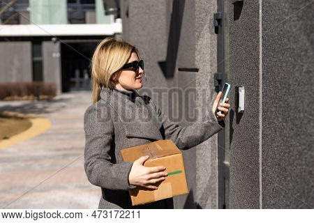 Smart Home Concept - Close Up Of Woman Use Mobile Phone To Open Electronic Lock