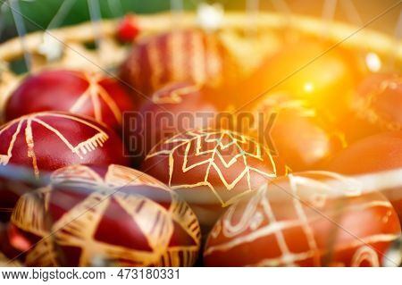 Sunny Easter Background. Closeup Of Basket Of Colored Red Eggs, Easter Holiday Concept. Modern Paint