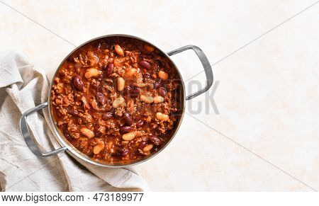 Cowboy Beans With Ground Beef, Jalapeno Pepper And Bacon In Cooking Pan Over Light Stone Background.