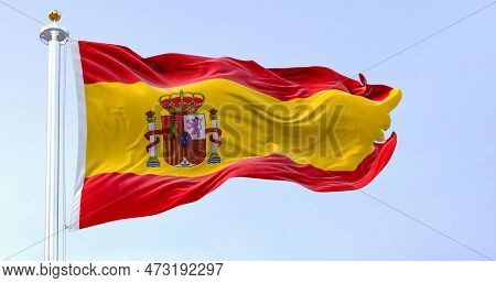 The National Flag Of Spain Waving In The Wind In A Clear Day. European Country. Three Horizontal Str
