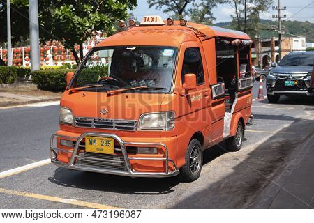 Parked Red Hijet Pickup Truck Converted To Carry Passengers In The Back