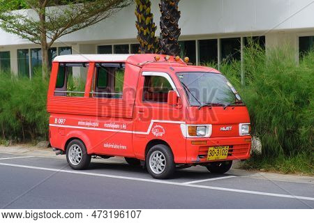 Parked Red Hijet Pickup Truck Converted To Carry Passengers In The Back