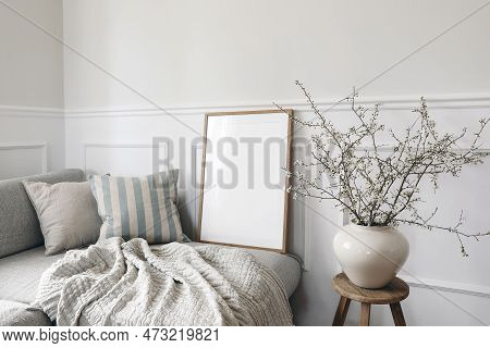 Modern Spring Scandinavian Living Room Interior. Wooden Picture Frame, Poster Mockup. Sofa With Line