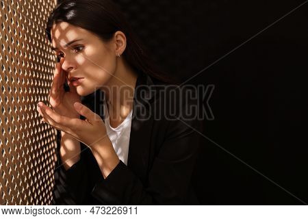 Woman Talking To Priest During Confession Near Wooden Partition In Booth, Space For Text