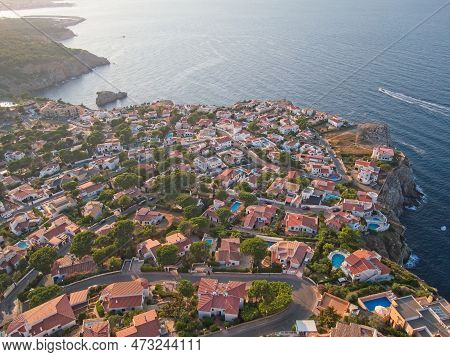 Houses On Montgo Mountain Cliff In Town L'escala In Catalonia, Spain.