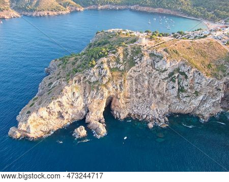Aetial View Of Torre De Montgó Tower And And Caves Near Montgó Cliff In Town L'escala, Catalonia, Sp