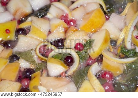 Currant Berries, Apples And Mint Leaves In Compote. Preparation Of Compote From Fruits, Berries And