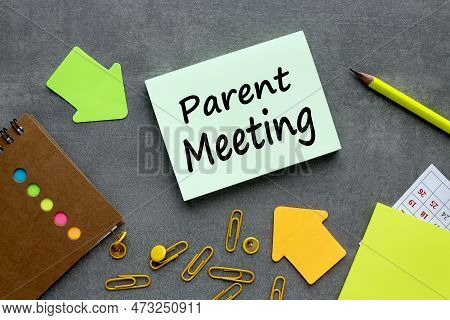 Parent Meeting. Text On Green Sticker. On A Gray Background Near Bright Stickers And Paper Clips
