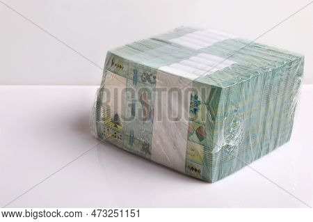 A Stack Of Lebanese Pounds, 100,000 Denomination, Symbolizing The Downfall Of The Lebanese Currency.