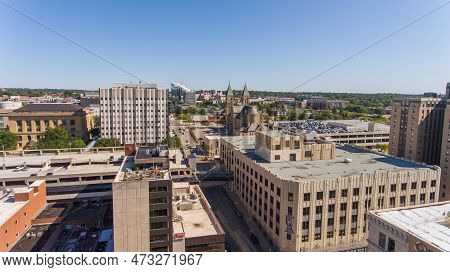 September 18th, 2019 - Akron Ohio USA: An aerial view down University Ave in Downtown Akron. It is a sunny day, and you can see the Goodyear Polymer Center and St. Bernard Catholic Church in the distance.