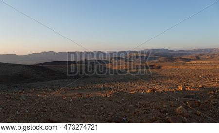 Negev Desert Landscape At Sunrise On The Bottom Of The Crater Makhtesh Gadol, In The South Of Israel